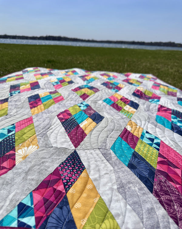 Strip N' Dip, a finished quilt from the quilt along